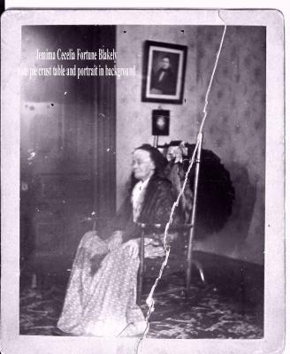 JEMIMA FORTUNE BLAKELY.
Notice the pie crust table and the portrait of her husband in background.